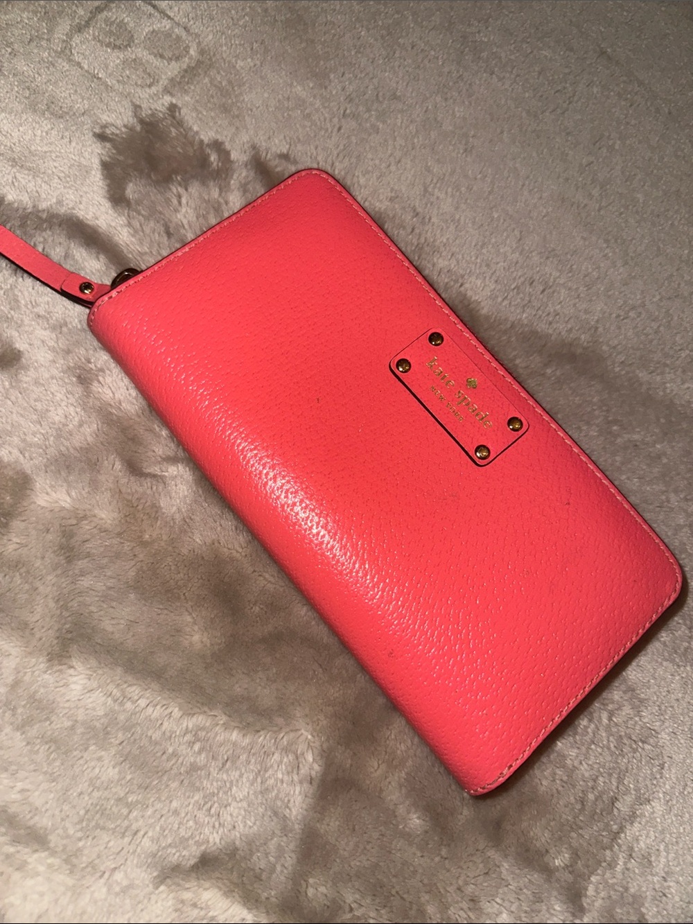 kate spade coral pink pebbled leather wristlet